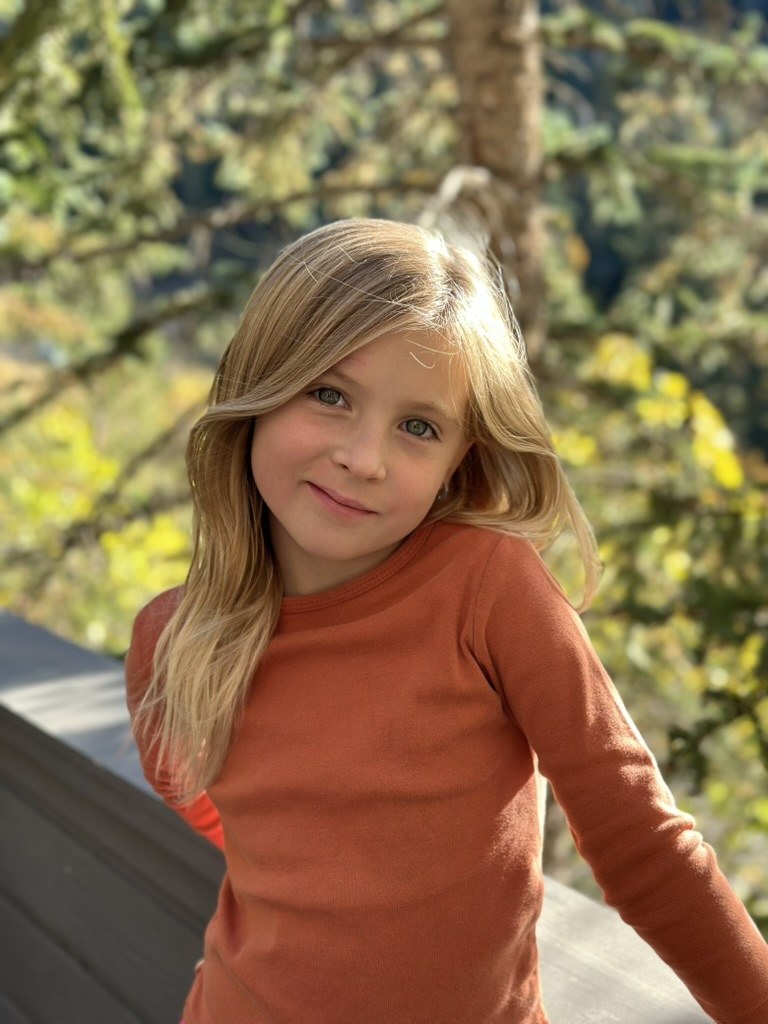 Brielle at the Park City house with autumn trees